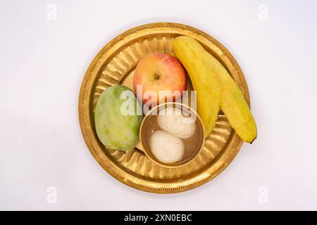 Puja Thali with Apple Banana Mango Fruits and Indian Sweets Rasbhari ...