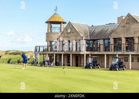 Golfers on the practice putting green outside Pilmour House, the clubhouse for the New Course and the Jubilee Course, St Andrews Links, St Andrews, Stock Photo