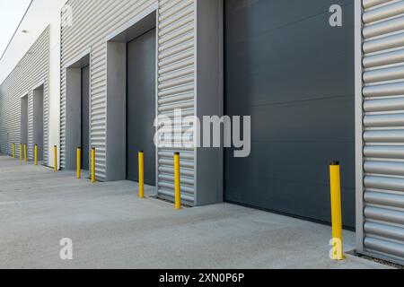 Exterior of an industrial unit with metal roller shutter doors Stock Photo