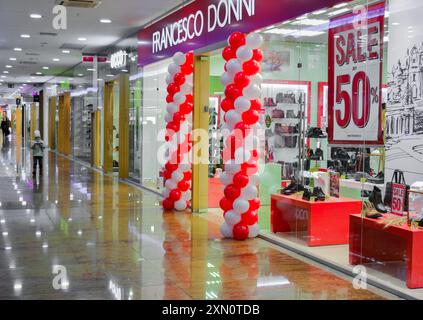 Moscow, Russia, November 2019: Shoe store Sale, black Friday, fifty percent off. The entrance is decorated balls, inside shopping mall, pass buyers. Stock Photo