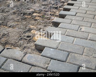 Paving stones in the process of laying Stock Photo