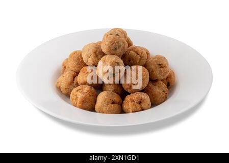 Breaded and fried meatballs in white plate isolated on white with clipping path included Stock Photo
