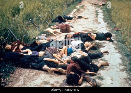 My Lai massacre, women and children after being killed by American GIs. My Lai massacre. Vietnamese men, women and children killed in the My Lai Massacre during the Vietnam War. The aftermath of the My Lai massacre showing mostly women and children dead on a road. Stock Photo