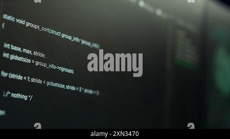 Extreme close up shot of lines of code displayed on computer monitors used by cybercriminal stealing sensitive information. Virus scripts running on PC infecting network systems, breaking passwords Stock Photo