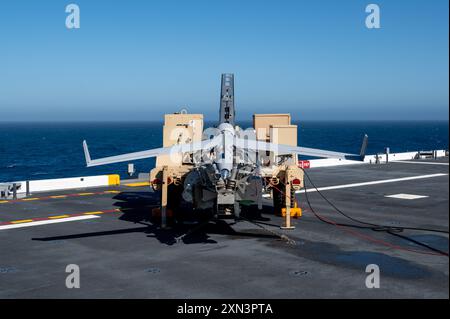 West Coast-based Naval Special Warfare (NSW) operators fast rope from ...