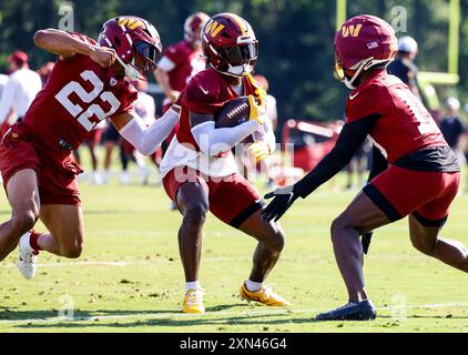 Washington Commanders safety Jeremy Reaves (39), cornerback Noah Igbinoghene (19) and safety Darrick Forrest (22) participating in drills during practice at the OrthoVirginia Training Center at Commanders Park in Ashburn VA on July 28 2024 (Alyssa Howell/Image of Sport) Stock Photo