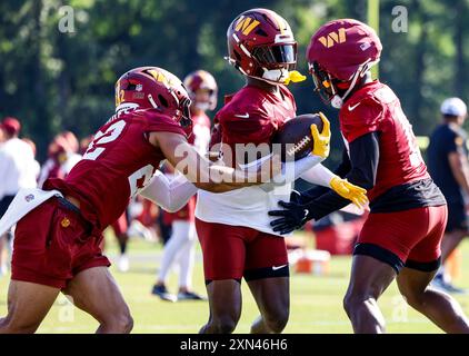 Washington Commanders safety Jeremy Reaves (39), cornerback Noah Igbinoghene (19) and safety Darrick Forrest (22) participating in drills during practice at the OrthoVirginia Training Center at Commanders Park in Ashburn VA on July 28 2024 (Alyssa Howell/Image of Sport) Stock Photo