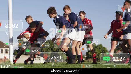 Image of social media icons with growing numbers over diverse male rugby players. Global social media, sports, communication and digital interface con Stock Photo