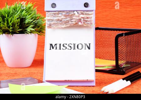 Mission word on a loose leaf of a desktop notebook Stock Photo