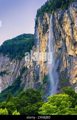 The Staubbach Falls is a 297-metre-high waterfall in Lauterbrunnen, Switzerland, whose waters fall from the left flank of the Lauterbrunnen Valley in Stock Photo