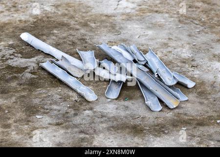 Broken pieces of plastic pipes used in building fittings work. They are used for power lines, water, or sanitary purposes in house or office. Stock Photo