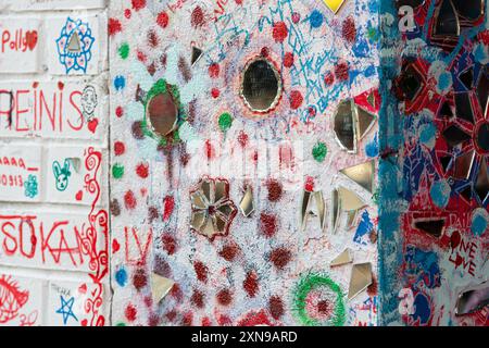 Riga, Latvia - September 30, 2020: Colorful abstract mural adorned with geometric patterns and mirrors in a lively space. Stock Photo