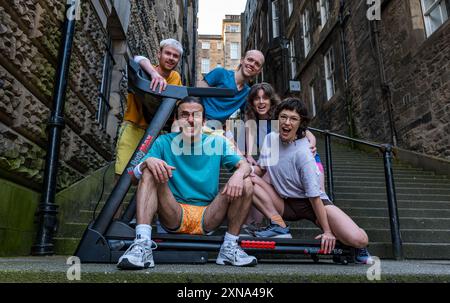 Edinburgh, Scotland, UK, 31 July 2024, Edinburgh Festival Fringe: Australian company Pony Cam make their Edinburgh Fringe debut with their show Burnout Paradise, multi-tasking on four treadmills.  The performers pose carrying treadmills up the Warriston’s Close staircase in the city’s Old Town. Credit: Sally Anderson/Alamy Live News Stock Photo