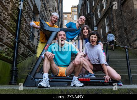 Edinburgh, Scotland, UK, 31 July 2024, Edinburgh Festival Fringe: Australian company Pony Cam make their Edinburgh Fringe debut with their show Burnout Paradise, multi-tasking on four treadmills.  The performers pose carrying treadmills up the Warriston’s Close staircase in the city’s Old Town. Credit: Sally Anderson/Alamy Live News Stock Photo