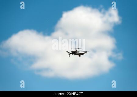 Drone on the Clouded Sky Stock Photo