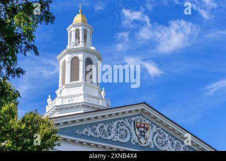 Boston, Massachusetts, USA - August 19, 2023: Top of the entrance portico and bell tower of the Baker Library on the Harvard Business School campus. Stock Photo