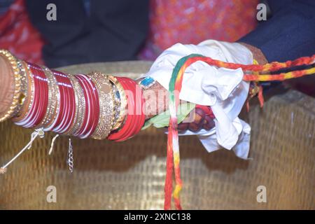 Wedding Couple Nice Hands, hindu groom and bride's hands during marriage ceremony, water eclipse ceremony Stock Photo