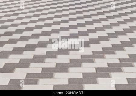 Grey Paving Tile, background. Pedestrian zone in city in daylight. Stock Photo
