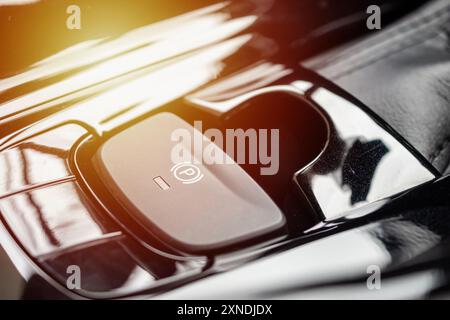 electronic handbrake button in luxury modern car Stock Photo