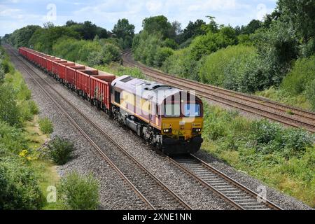 DB Cargo Class 66 number 66095 approaching North Stafford Junction with a Walsall Freight Terminal to Dowlow Briggs (Buxton) rake of empty box wagons Stock Photo