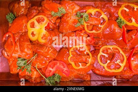 Top view of marinated raw chicken displayed in retail store. Stock Photo