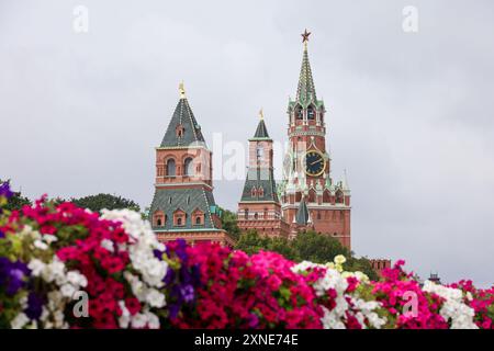 View through the flowers to Kremlin towers on Red Square in Moscow Stock Photo