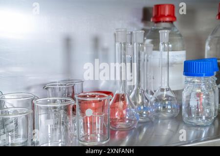 Chemical glassware flasks, beakers and bottles in the laboratory.  Stock Photo