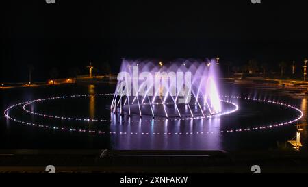 the fountain showing with lighting in night time Stock Photo - Alamy