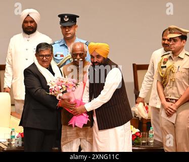 Chandigarh, India. 17th June, 2020. CHANDIGARH, INDIA - JULY 31: Punjab Chief Minister Bhagwant Mann greets greets new Governor of Punjab Gulab Chand Kataria during his swearing in ceremony at Punjab Raj Bhawan on July 31, 2024 in Chandigarh, India. also present. (Photo by Sanjeev Sharma/Hindustan Times/Sipa USA) Credit: Sipa USA/Alamy Live News Stock Photo