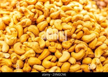 Tasty cashew nuts as background. Top view. Stock Photo