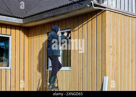 Installing metal window slopes and metal window sills in window opening ...