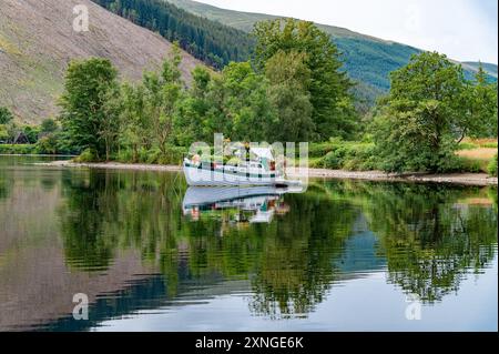 Invergarry, Highlands, Scotland, UK. 31st July, 2024. A flowery boat on a fine day at Loch Oich in the Highlands of Scotland in the Great Glen near Invergarry. Credit: John Eveson/Alamy Live News Stock Photo