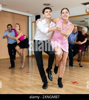 Young pair practicing Latino dance in dance studio Stock Photo