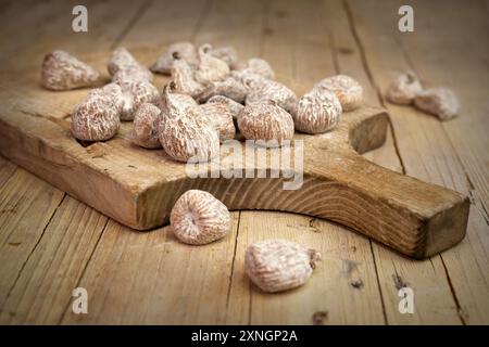 Ripe figs on wooden table with rustic background Stock Photo