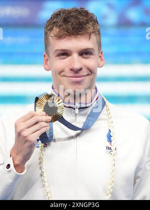 Paris, France. 31st July, 2024. Men's 200m Breaststroke Finals gold medalist Leon Marchand of France holds his medal at the Paris 2024 Olympics at the Arena Le Defense in Paris, France on Tuesday, July 31, 2024. Photo by Richard Ellis/UPI Credit: UPI/Alamy Live News Stock Photo