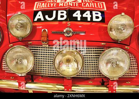 British Motor Museum Gaydon a 1965 Monte Carlo Rallye bright  red Morris Cooper Mini car with a set of five spotlamps Stock Photo