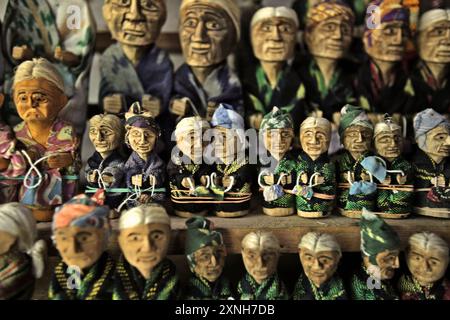 Miniatures of wooden effigies at a souvenir shop in Lemo, North Toraja, South Sulawesi, Indonesia. Stock Photo