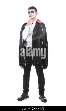 Young man dressed for Halloween as vampire on white background Stock Photo