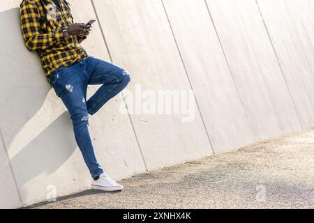 unrecognizable man writing a message at phone Stock Photo