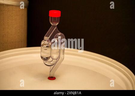 Airlock on home brewing bucket close up view Stock Photo