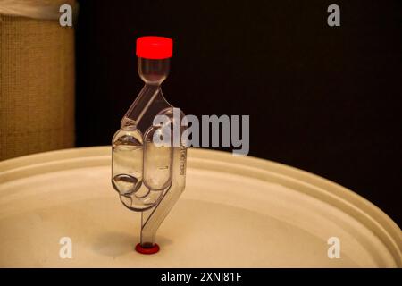 Airlock on home brewing bucket close up view Stock Photo