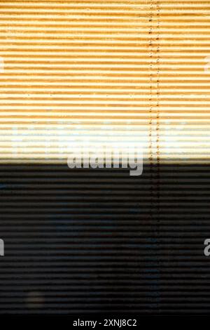 Shop shutter texture background with two tone shadow vertical orientation close up view Stock Photo