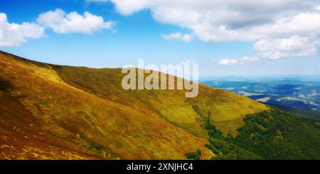 scenery with grassy slopes of borzhava ridge. magnificent carpathian mountain landscape in dappled light. beautiful view of transcarpathia highland in Stock Photo