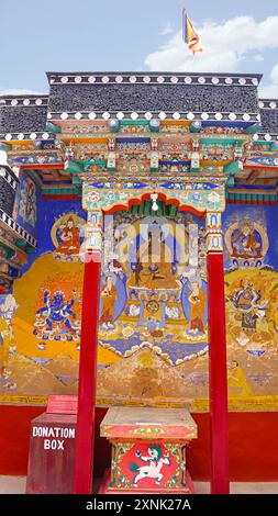 Colorful painting of Lord Buddha on the wall of Thiksey Monastery, Leh, Ladakh, India. Stock Photo