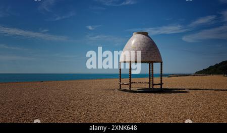 Beach shelter on Folkestone Beach in Kent UK Stock Photo