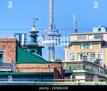 Toronto, Canada - July 29, 2024: Unusual view of the CN Tower and the cityscape Stock Photo