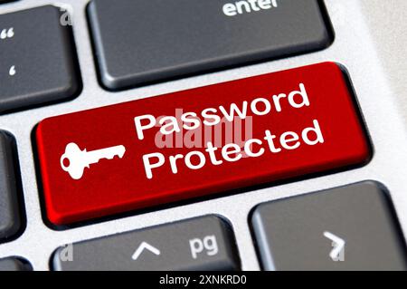 Password protected on red laptop keyboard button. Security and password concept. Stock Photo