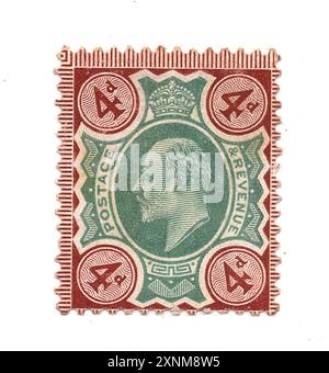 A vintage King Edward VII 4d postage stamp from Great Britain on a white background. Stock Photo