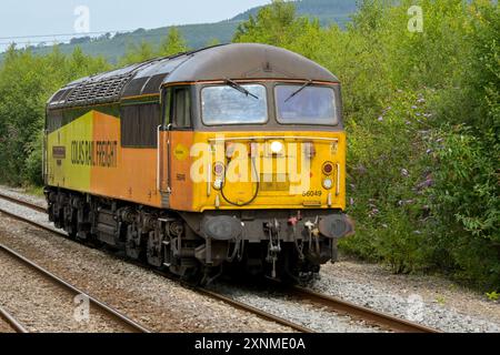 Pontyclun, Wales, UK. - 31 July 2024:  Class 56 diesel locomotive operated by Colas Rail Freight running alone without trucks near Pontyclun in south Stock Photo