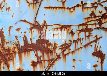 cracked rust structure on blue painted old iron metal, grunge industrial background Stock Photo